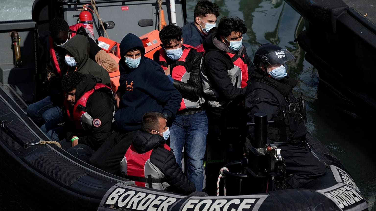 FILE - People thought to be migrants who undertook the crossing from France in small boats and were picked up in the Channel, 17 June 2022. 