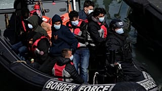FILE - People thought to be migrants who undertook the crossing from France in small boats and were picked up in the Channel, 17 June 2022.