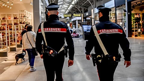 FILE: Carabinieri officers patrol in Assago, on the outskirts of Milan, Italy, Friday Oct. 28, 2022.