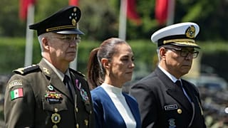 Mexican President Claudia Sheinbaum, center, with Defense Minister Gen. Ricardo Trevilla Trejo, left