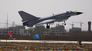 FILE: A Chinese People's Liberation Army Airforce's "Bayi Aerobatic Unit" J-10 fighter jet takes off during an aerial demonstration, 13 April 2010