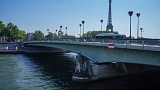 The Pont de l' Alma seen with the Eiffel Tower in the background in Paris