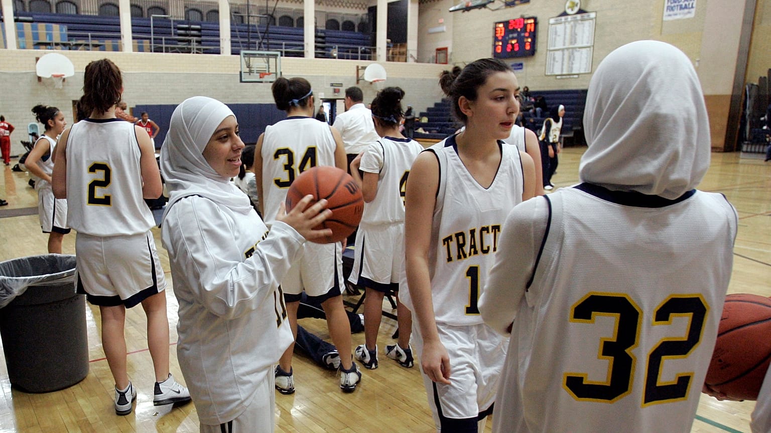 Fordson High School basketball player Fatima Kobeissi, left and teammate Hyatt Bakri  wait before the basketball game against Willow Run in Dearborn, Michigan, 4 December 2007