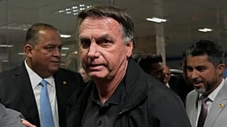 Former Brazilian President Jair Bolsonaro arrives for a luncheon with senators from his support base, at the National Congress building in Brasilia, Tuesday, Feb. 18, 2025.
