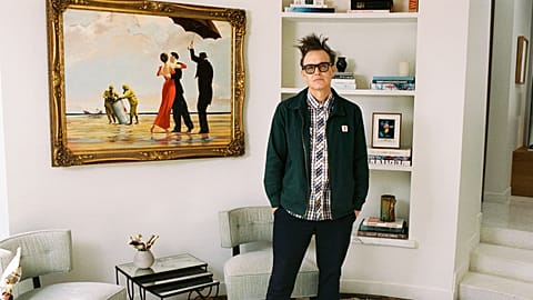 Mark Hoppus of Blink-182 poses by his painting Crude Oil (Vettriano) by Banksy (2005), which is being sold by Sotheby's on 4 March. 