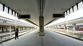FILE: A man walks along the tracks at Vienna's Westbahnhof station, 3 June 2003