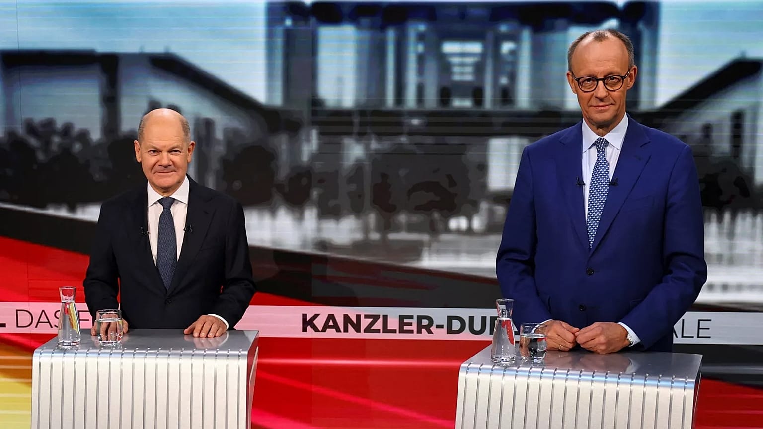 Olaf Scholz e Friedrich Merz enfrentam-se no último debate antes das eleições alemãs