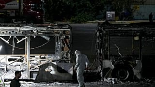 Israeli police inspect the scene of one of a series of bus explosions in what authorities said appeared to be a militant attack in Bat Yam, central Israel, Feb 20, 2025