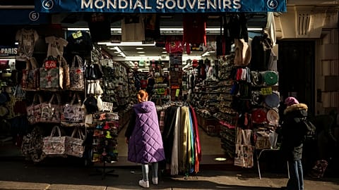 File photo of a woman looking at a souvenir shop of Montmartre during a cold day in Paris, Saturday, Jan. 5, 2025. 