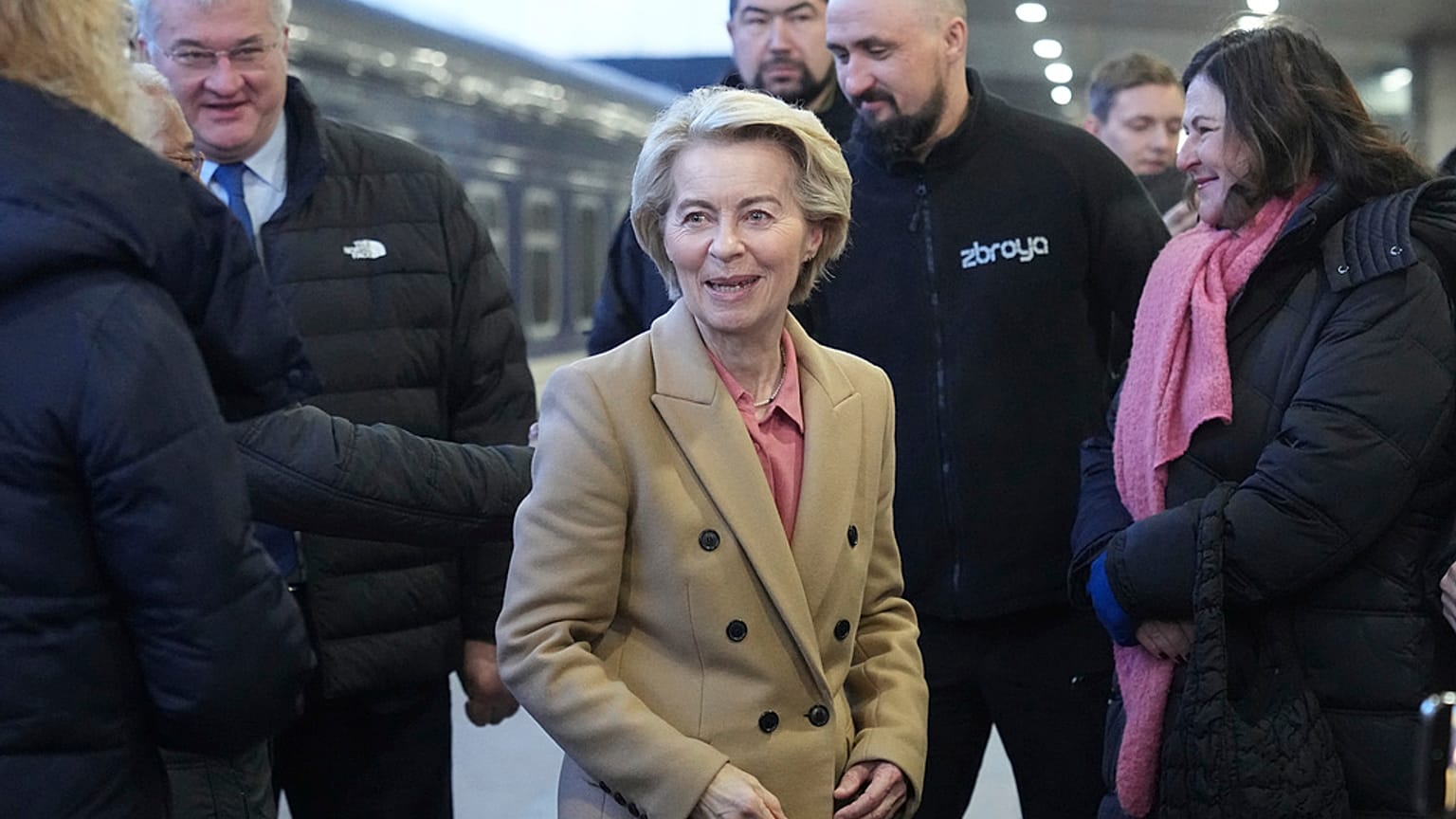 European Commission President Ursula von der Leyen, center, arrives at a train station on the third anniversary of the Russian invasion of Ukraine, Kyiv, Ukraine, Monday, Feb.
