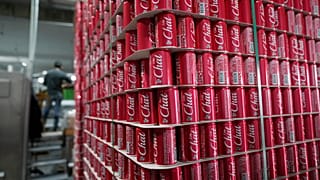 Pallets of branded cans at the production line in the Palestinian Chat Cola bottling plant, in the West Bank city of Salfit