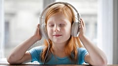A young girl listens to 'One Day in the Life of Ivan Denisovich' by Aleksandr Solzhenitsyn