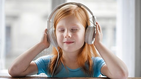 A young girl listens to 'One Day in the Life of Ivan Denisovich' by Aleksandr Solzhenitsyn