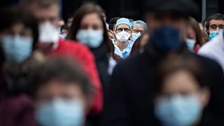 Medical staff observe a minute of silence while protesting a lack of resources outside the Strasbourg University Hospital, eastern France.