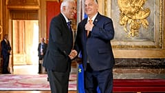 European Council President Antonio Costa, left, greets Hungary's Prime Minister Viktor Orban as he arrives for an EU summit at the Egmont Palace in Brussels, Monday