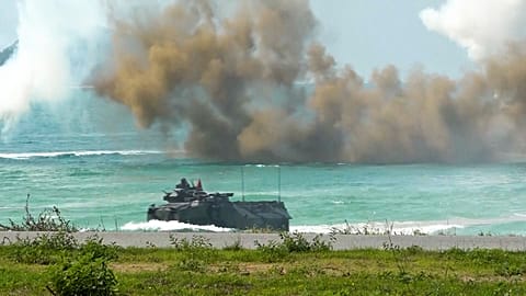 Various of amphibious vehicles coming onto beach