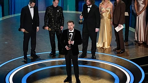 Gregory Zalcman, from left, Ron Dyens, Gints Zilbalodis, center, and Matiss Kaza accept the award for best animated feature film for "Flow" during the Oscars
