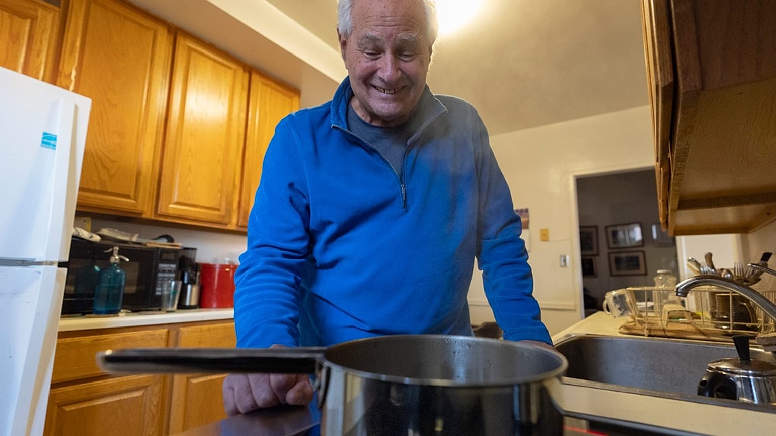 Ed Yaker boils water on an electric induction stove