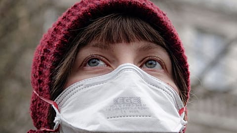 A woman wearing a gas mask takes part in a protest against air pollution, in Sarajevo, Bosnia, 20 January 2020. 
