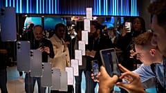 Visitors take pictures of the newly introduced phone the Galaxy S25 Edge, during the Mobile World Congress in Barcelona, Spain, Monday, March 3, 2025
