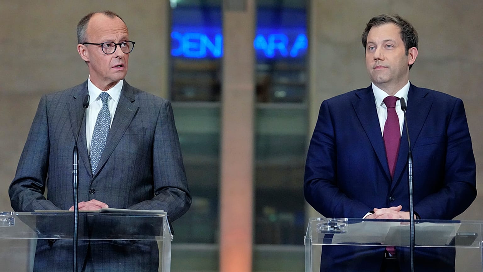 Friedrich Merz, left, leader of CDU and Lars Klingbeil, co-leader of SPD address the media during a press conference in Berlin, Germany, Tuesday, March 4, 2025 