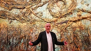 Anselm Kiefer talks in front of his artwork The Starry Night during a press preview of the Anselm Kiefer exhibit. 