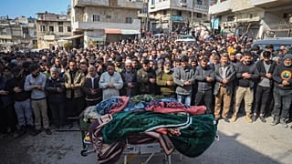 Male villagers at funeral of four Syrian security force members killed in clashes with loyalists of ousted President Bashar Assad in village of Al-Janoudiya, March 8th 2025