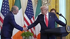 Ireland's Prime Minister Micheál Martin shakes hands with President Donald Trump during an event in the East Room of the White House in Washington, Wednesday, March 12, 2025.