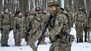 Members of Ukraine's Territorial Defense Forces, volunteer military units of the Armed Forces, train in a city park in Kyiv, Ukraine, 22 January 2022.