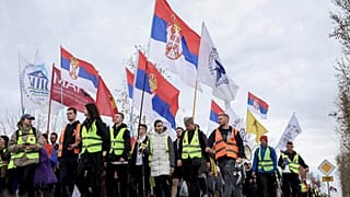 Students and anti-government protesters march to Belgrade for a joint protest after taking a break in Nova Pazova, Serbia, Friday, March 14, 2025. (AP Photo/Armin Durgut)