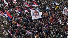 Protesters march during a major rally against President Aleksandar Vucic and his government, in downtown Belgrade, Serbia, Saturday, March 15, 2025. (AP Photo/Armin Durgut)