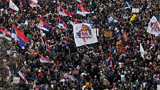 Protesters march during a major rally against President Aleksandar Vucic and his government, in downtown Belgrade, Serbia, Saturday, March 15, 2025. (AP Photo/Armin Durgut)