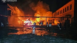 In this photo provided by the Ukrainian Emergency Service, fire engines burn after a Russian drone hit them when firefighters were putting out a fire at a lyceum. 15/03/2025