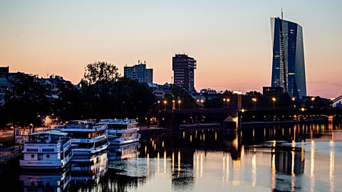 The sun rises next to the European Central Bank at the river Main in Frankfurt, Germany. 22 August 2019.