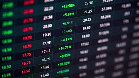 A stock market screen showing green and red indicators. 