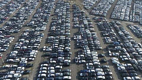 New German cars are stored at a logistic center in Essen, Germany, Monday, Feb. 3, 2025, as US President Trump threatens the European Union (EU) with new tariffs.