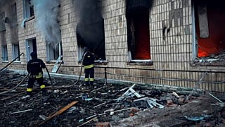 In this photo provided by the Ukrainian Emergency Service on Wednesday, March 19, 2025, firefighters work on a site of a Russian attack in Krasnopillia, Sumy region, Ukraine.