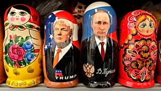 Traditional Russian nesting dolls depicting US President Donald Trump and Russian President Vladimir Putin are displayed for sale at a souvenir stree in St.Petersburg, Russia.