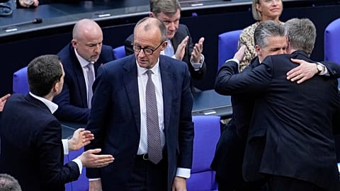 Christian Democratic Union party chairman Friedrich Merz, centre, reacts after a debate and voting about loosen the country's debt rules, Berlin, Germany, Tuesday, 2025.