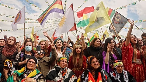 Syrian Kurdish women, most of them wearing traditional clothing, gather to celebrate their Nowruz, Kurdish New Year, in Qamishli, Syria