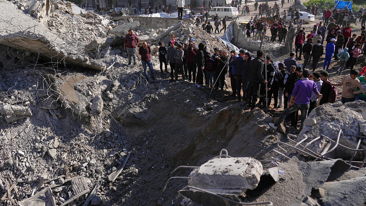 Palestinians inspect the site hit by Israeli bombardment in Gaza City, 23 March 2025