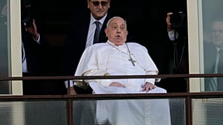 Pope Francis appears at a window of the Agostino Gemelli Polyclinic in Rome, Sunday, March 23, 2025,