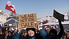 People take part in a march ending in front of the US consulate in Nuuk, 15 March, 2025