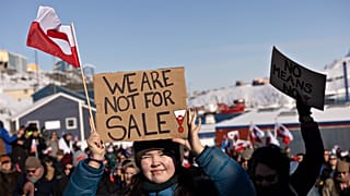 People take part in a march ending in front of the US consulate in Nuuk, 15 March, 2025