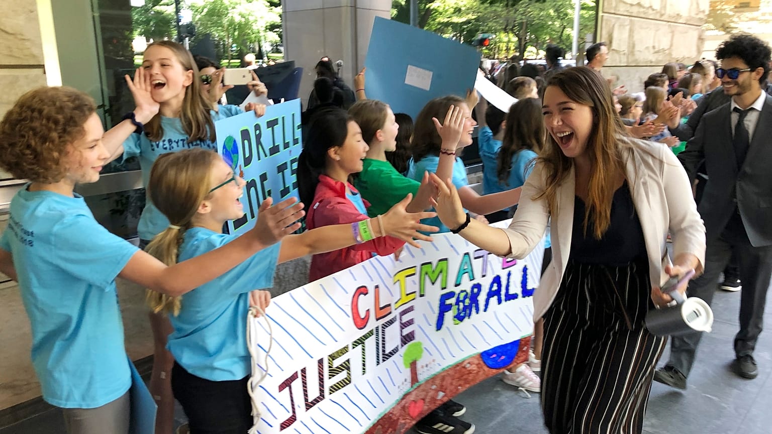  Kelsey Juliana, of Eugene, Ore., greets climate supporters outside a federal courthouse, June 4, 2019, in Portland, Ore. 