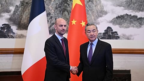 French Foreign Minister Jean- Noël Barrot is greeted by China's Foreign Minister Wang Yi in Beijing.