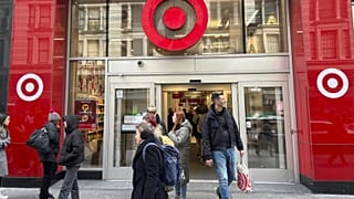 Shoppers walk from a Target store in midtown Manhattan in New York on Tuesday, March 19, 2024.
