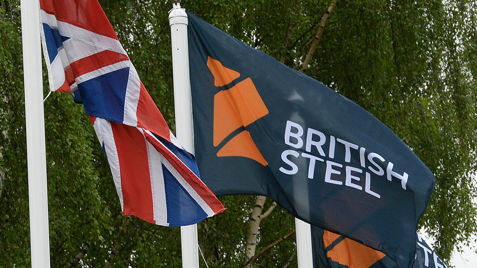 A flag with a British Steel logo at the entrance to the steelworks plant in Scunthorpe, England, June 1, 2016.