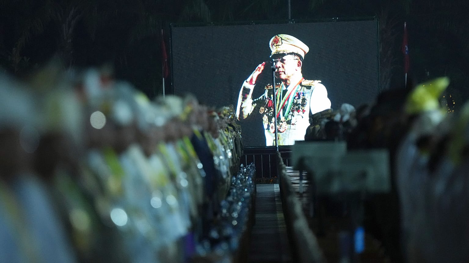 Junta chief Min Aung Hlaing is seen on a screen during a parade to commemorate Myanmar's 80th Armed Forces Day in Naypyidaw, 27 March, 2025