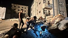 Volunteers work at the site of a building that collapsed after an earthquake in Mandalay, 29 March, 2025